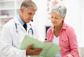 A woman with arthritis at an appointment with a doctor